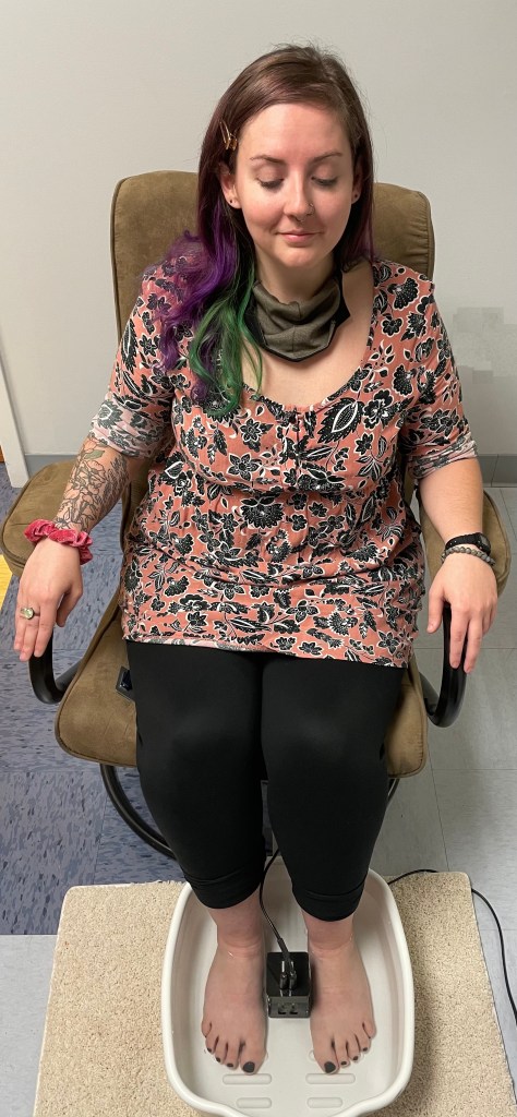 Woman relaxing while getting a foot detox treatment. 