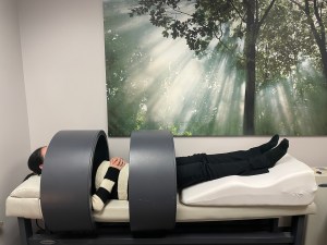 Woman relaxing while getting Pulsed Electro Magnetic Fields (PEMF) treatment